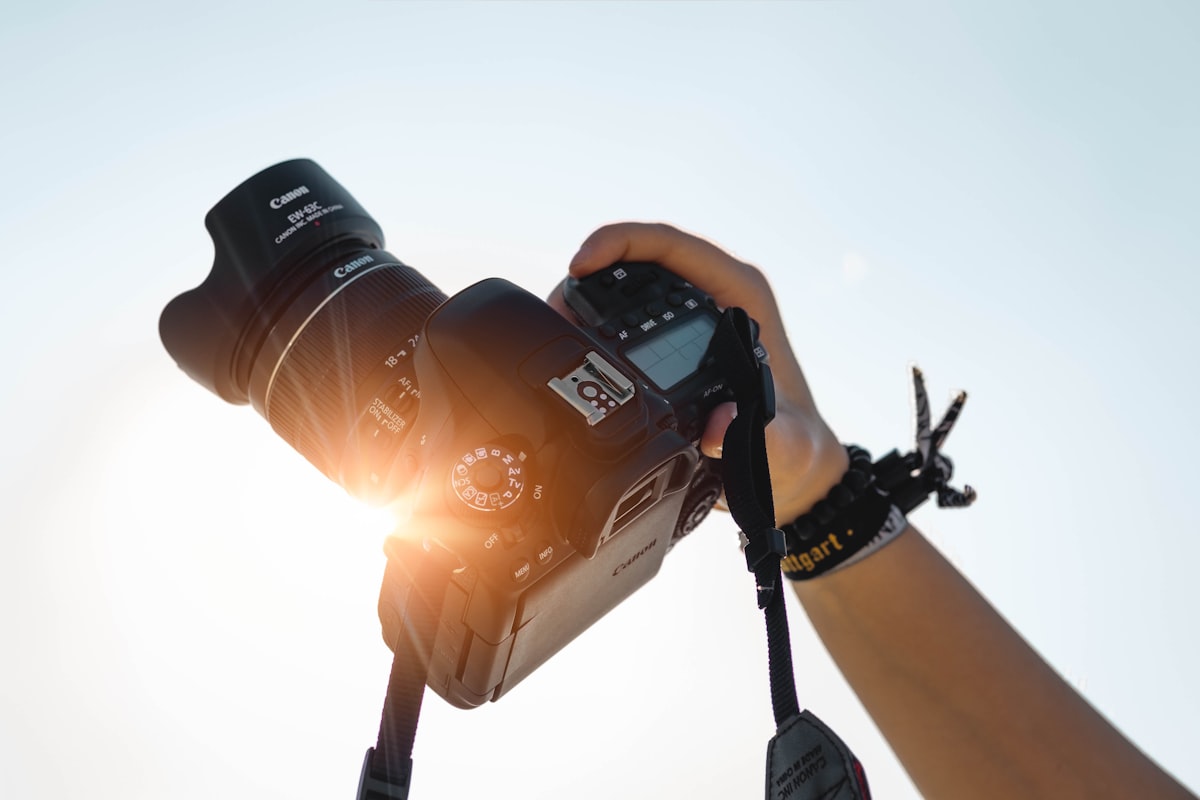 A photographer working with a camera